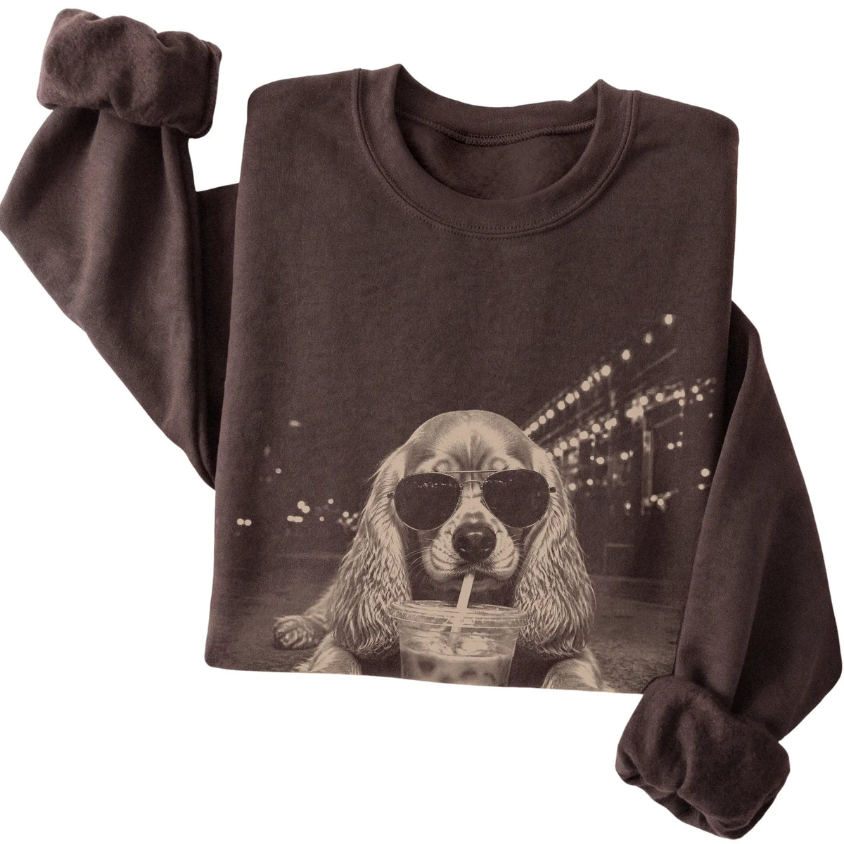 Cocker Spaniel wearing aviator sunglasses and drinking iced coffee on a Dark Chocolate Gildan Heavy Blend Crewneck Sweatshirt, folded view