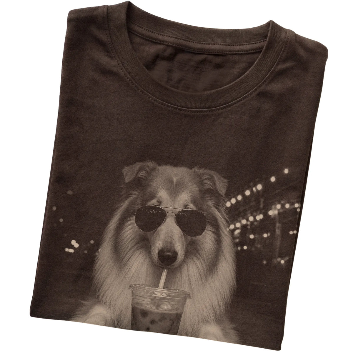 Collie wearing aviator sunglasses and drinking iced coffee on a Dark Chocolate Gildan Softstyle T-Shirt, folded view