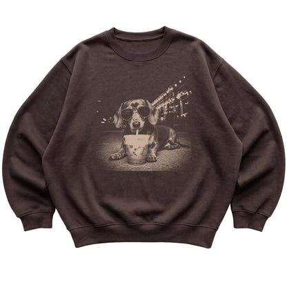 Dachshund wearing aviator sunglasses and drinking iced coffee on a Dark Chocolate Gildan Heavy Blend Crewneck Sweatshirt, flat lay view