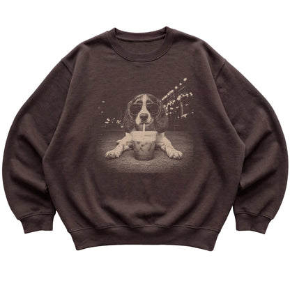 English Springer Spaniel wearing aviator sunglasses and drinking iced coffee on a Dark Chocolate Gildan Heavy Blend Crewneck Sweatshirt, flat lay view