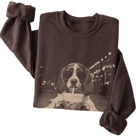 English Springer Spaniel wearing aviator sunglasses and drinking iced coffee on a Dark Chocolate Gildan Heavy Blend Crewneck Sweatshirt, folded view
