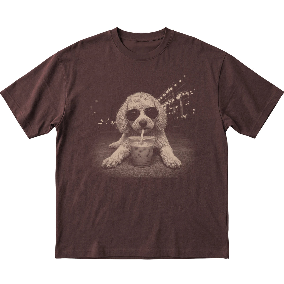 Goldendoodle wearing aviator sunglasses and drinking iced coffee on a Dark Chocolate Gildan Softstyle T-Shirt, flat lay view
