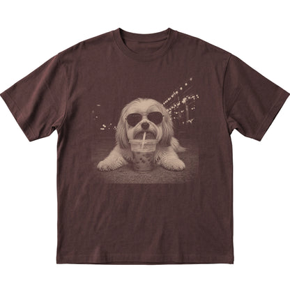 Havanese wearing aviator sunglasses and drinking iced coffee on a Dark Chocolate Gildan Softstyle T-Shirt, flat lay view