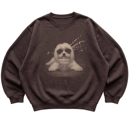 Maltese wearing aviator sunglasses and drinking iced coffee on a Dark Chocolate Gildan Heavy Blend Crewneck Sweatshirt, flat lay view