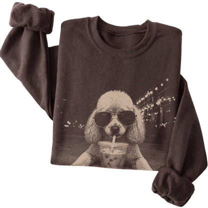 Poodle wearing aviator sunglasses and drinking iced coffee on a Dark Chocolate Gildan Heavy Blend Crewneck Sweatshirt, folded view