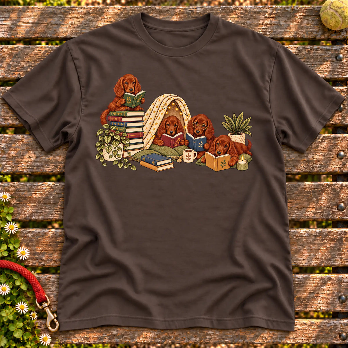 Irish Setter puppies reading books in a cozy blanket fort on a Dark Chocolate T-shirt