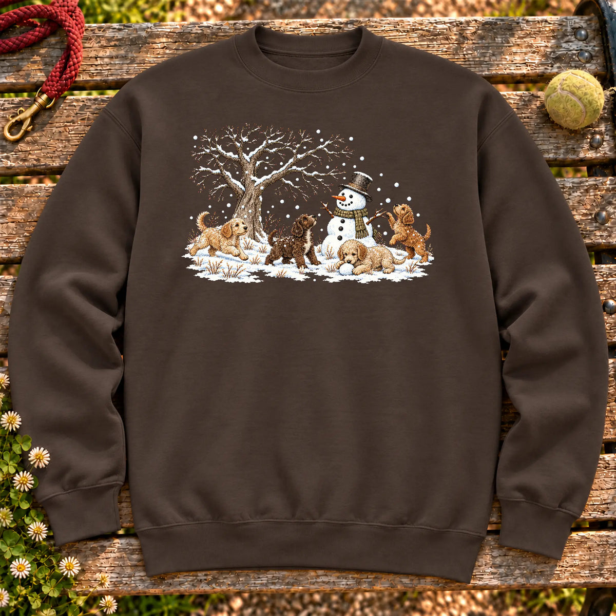 Labradoodle puppies playing in snow with a snowman on a Dark Chocolate sweatshirt