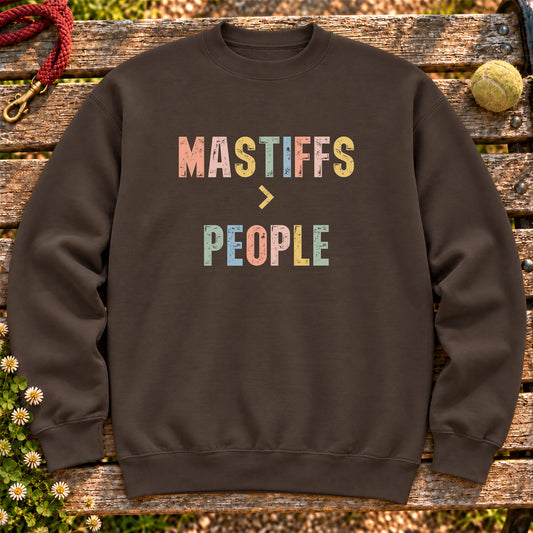 Mastiffs greater than people text design on a Dark Chocolate crewneck sweatshirt