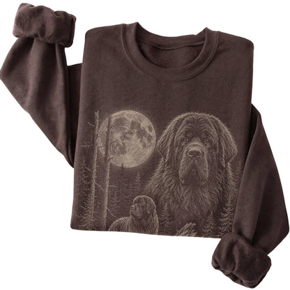 Folded dark chocolate crewneck sweatshirt showing the Newfie Moonlit Forest graphic