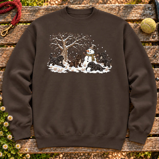 Newfie puppies playing in snow with a snowman on a Dark Chocolate sweatshirt