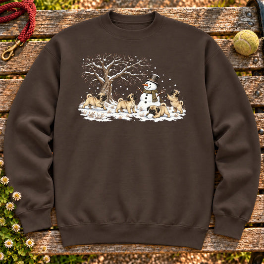 Pug puppies playing in snow with a snowman on a Dark Chocolate sweatshirt