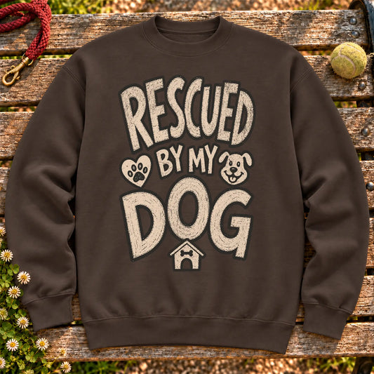 Rescued by my dog on a Dark Chocolate crewneck sweatshirt, shown flat