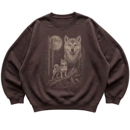 Shiba Inu Moonlit Forest graphic on a dark chocolate crewneck sweatshirt laid flat