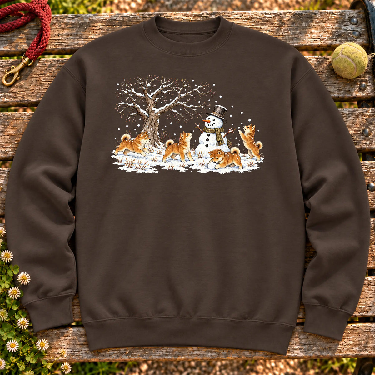 Shiba Inu puppies playing in snow with a snowman on a Dark Chocolate sweatshirt