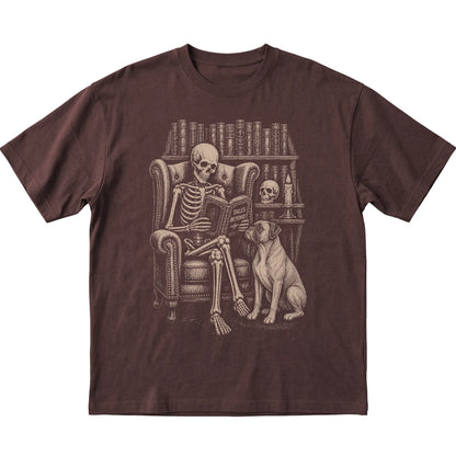 Skeleton reading Tales Beyond to a Boxer on a Dark Chocolate T-shirt