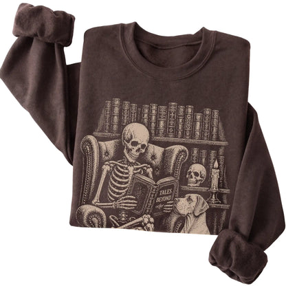 Folded Dark Chocolate sweatshirt with a skeleton reading Tales Beyond to a Great Dane