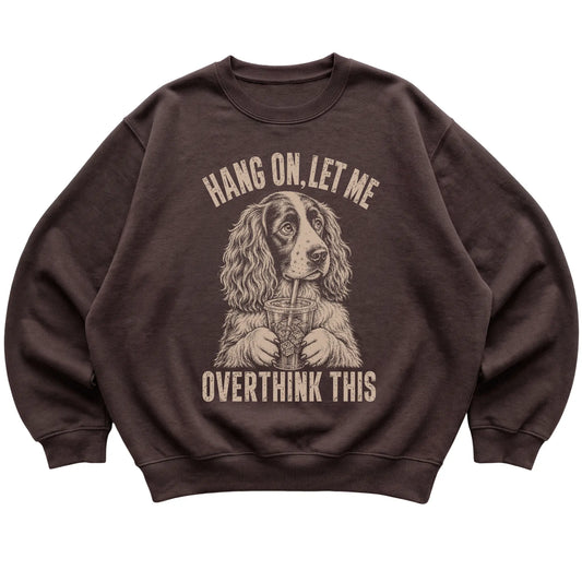 Dark Chocolate crewneck sweatshirt featuring Overthinking Springer Spaniel, laid-flat presentation
