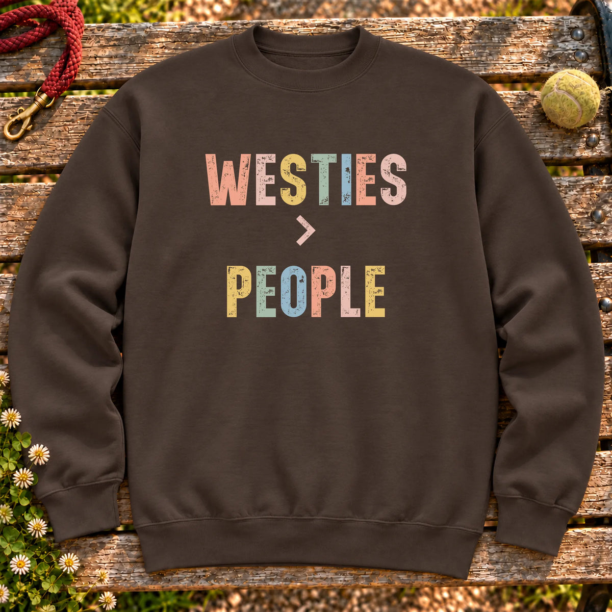 Westies greater than people text design on a Dark Chocolate crewneck sweatshirt