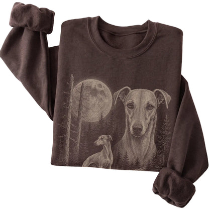 Folded dark chocolate crewneck sweatshirt showing the Whippet Moonlit Forest graphic