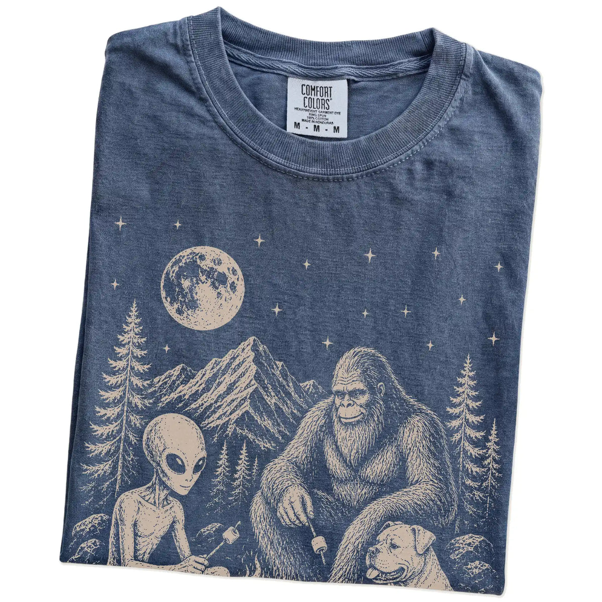 Folded Denim Comfort Colors® T-shirt showing American Bulldog camping with Bigfoot and an alien
