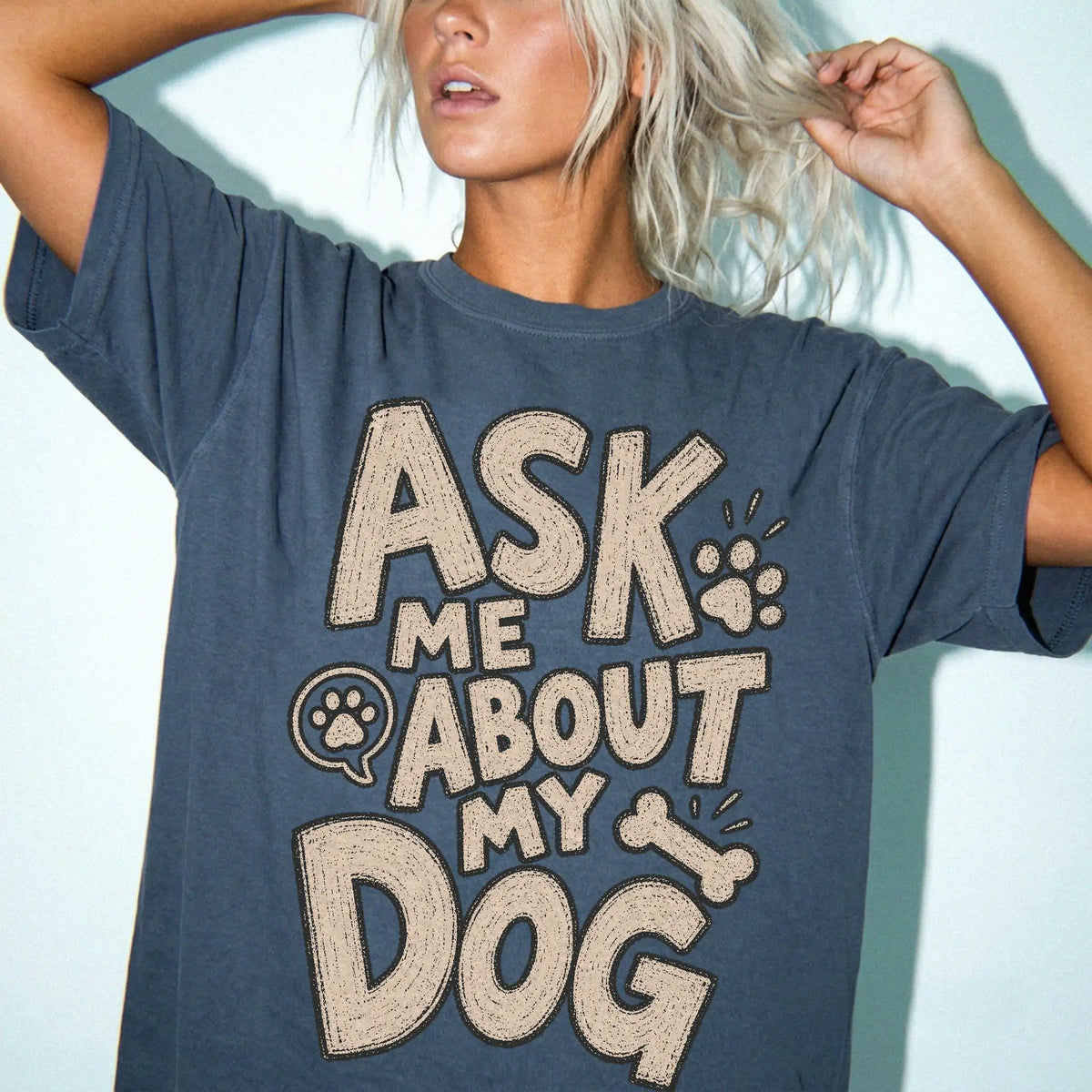 Model wearing a Denim Comfort Colors® T-shirt with “Ask me about my dog” lettering