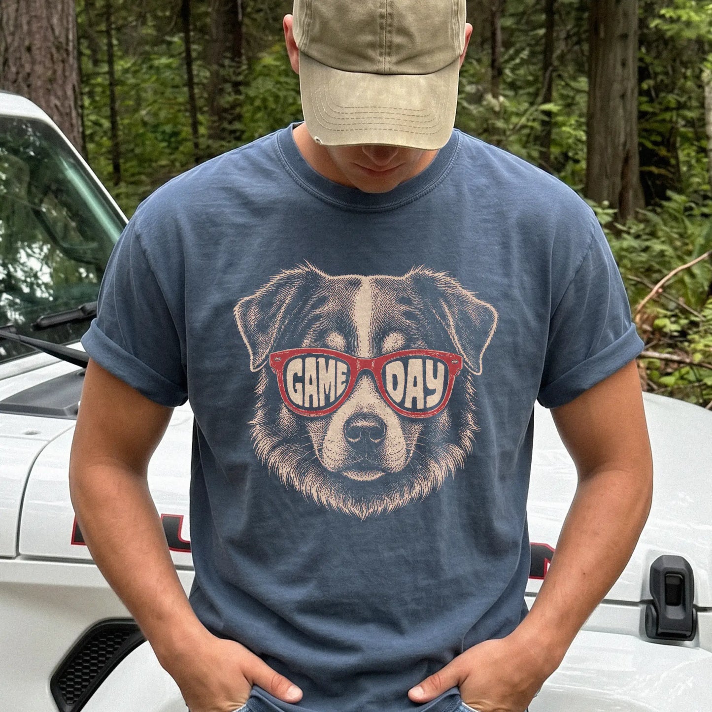 Model wearing a Denim Comfort Colors® T-shirt with australian shepherd wearing red game day sunglasses