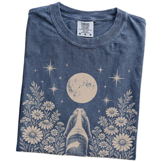 Folded Denim Comfort Colors® T-shirt showing Basset Hound beneath a wildflower moon