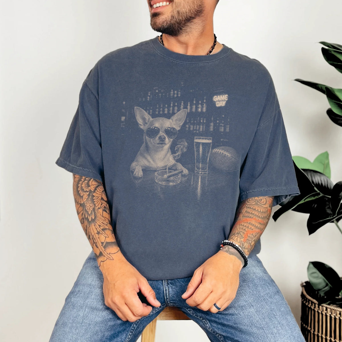 Model wearing a Denim Comfort Colors® T-shirt featuring Chihuahua with beer and football graphics
