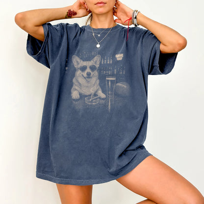 Model wearing a Denim Comfort Colors® T-shirt featuring Corgi with beer and football graphics