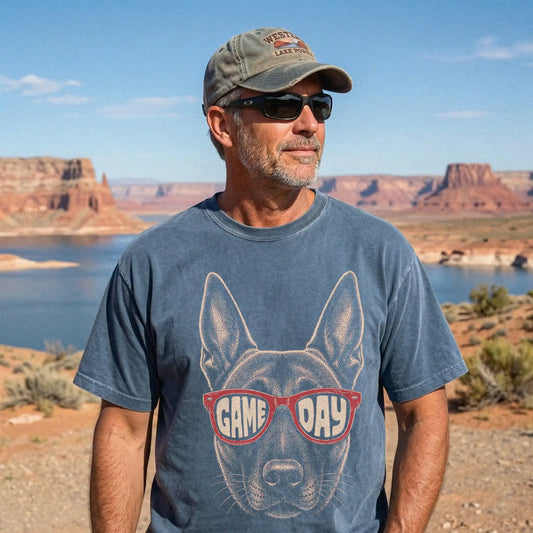 Model wearing a Denim Comfort Colors® T-shirt with belgian malinois wearing red game day sunglasses