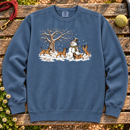 Belgian Malinois puppies playing in snow with a snowman on a Denim sweatshirt