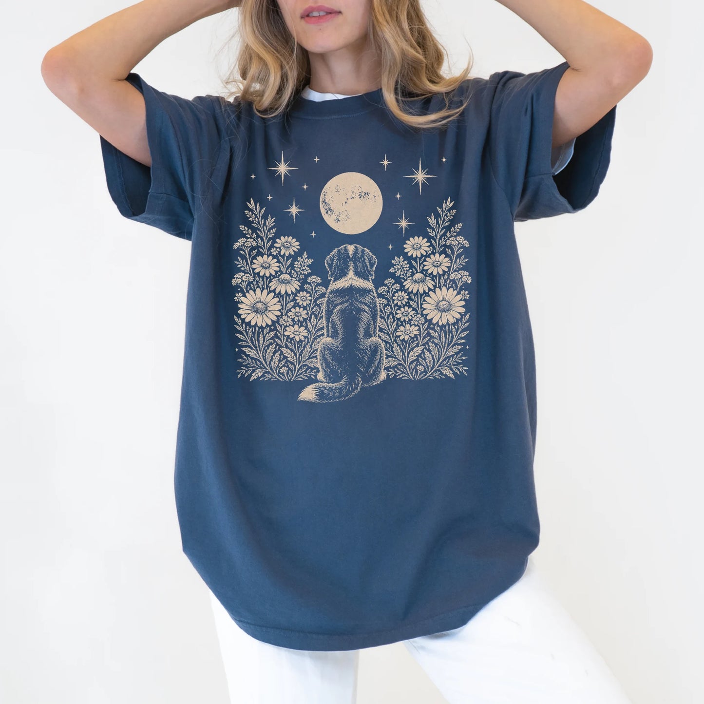 Model wearing a Denim Comfort Colors® T-shirt featuring Bernese Mountain Dog beneath a wildflower moon