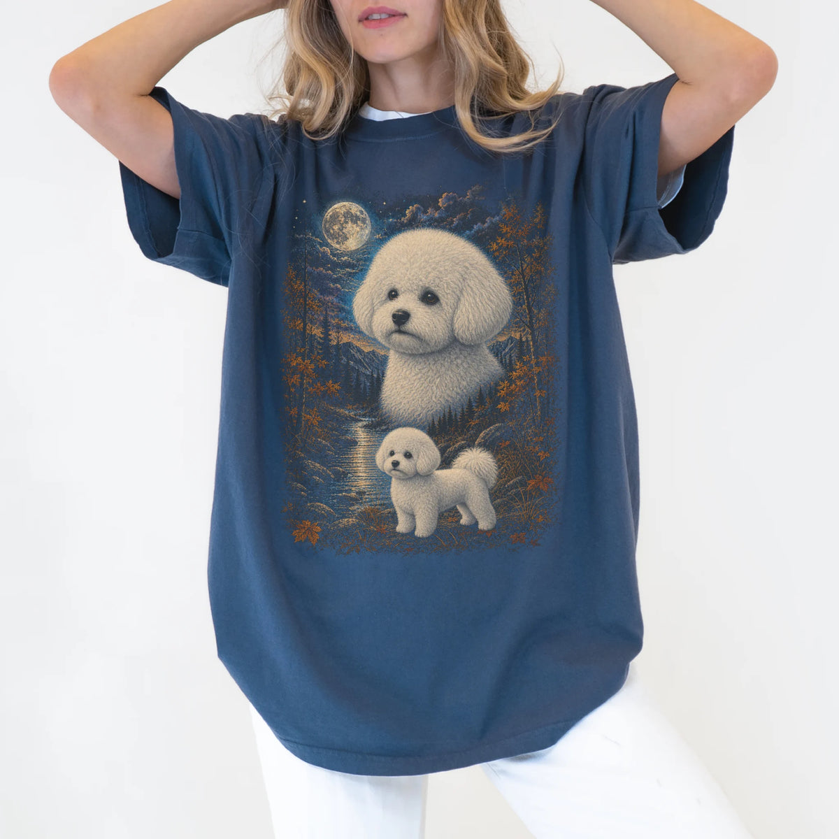 Model wearing a denim T-shirt with Bichon Frise Autumn Moon artwork.