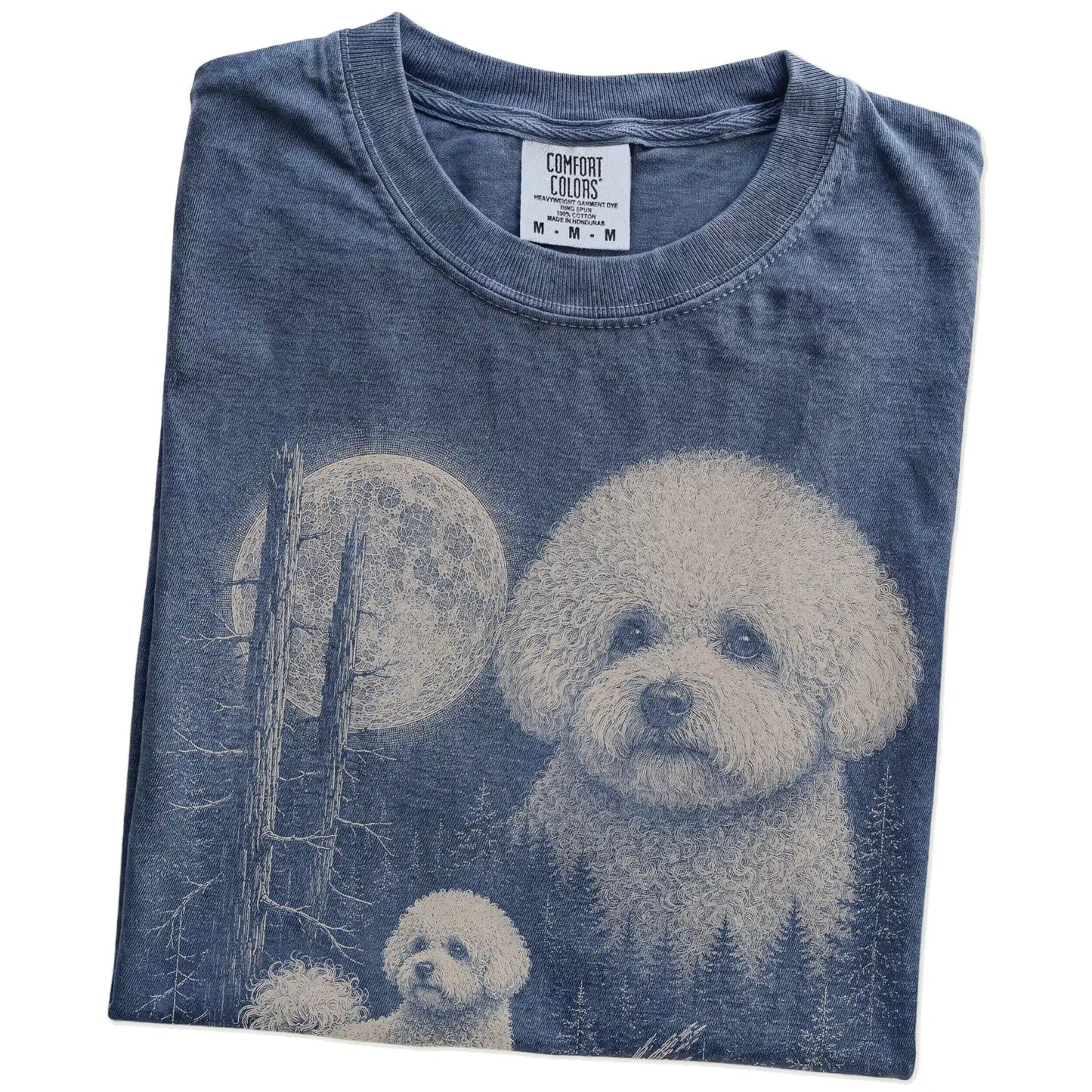 Folded Denim Bichon Frise Moonlit Forest T-Shirt showing the graphic