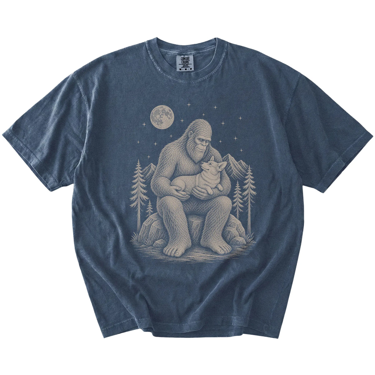 Bigfoot holding a Corgi on a Denim Comfort Colors® T-shirt