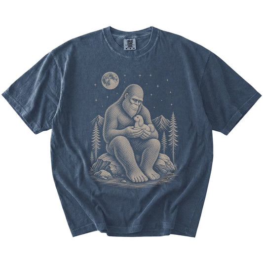 Bigfoot holding a Maltese on a Denim Comfort Colors® T-shirt
