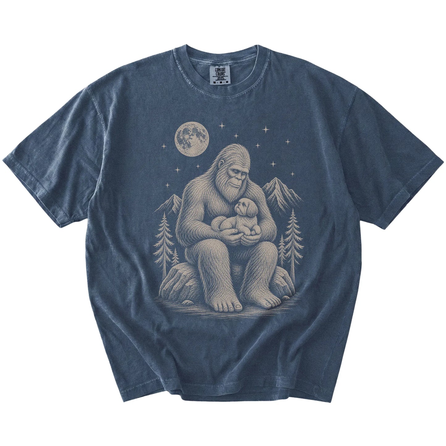 Bigfoot holding a Shih Tzu on a Denim Comfort Colors® T-shirt