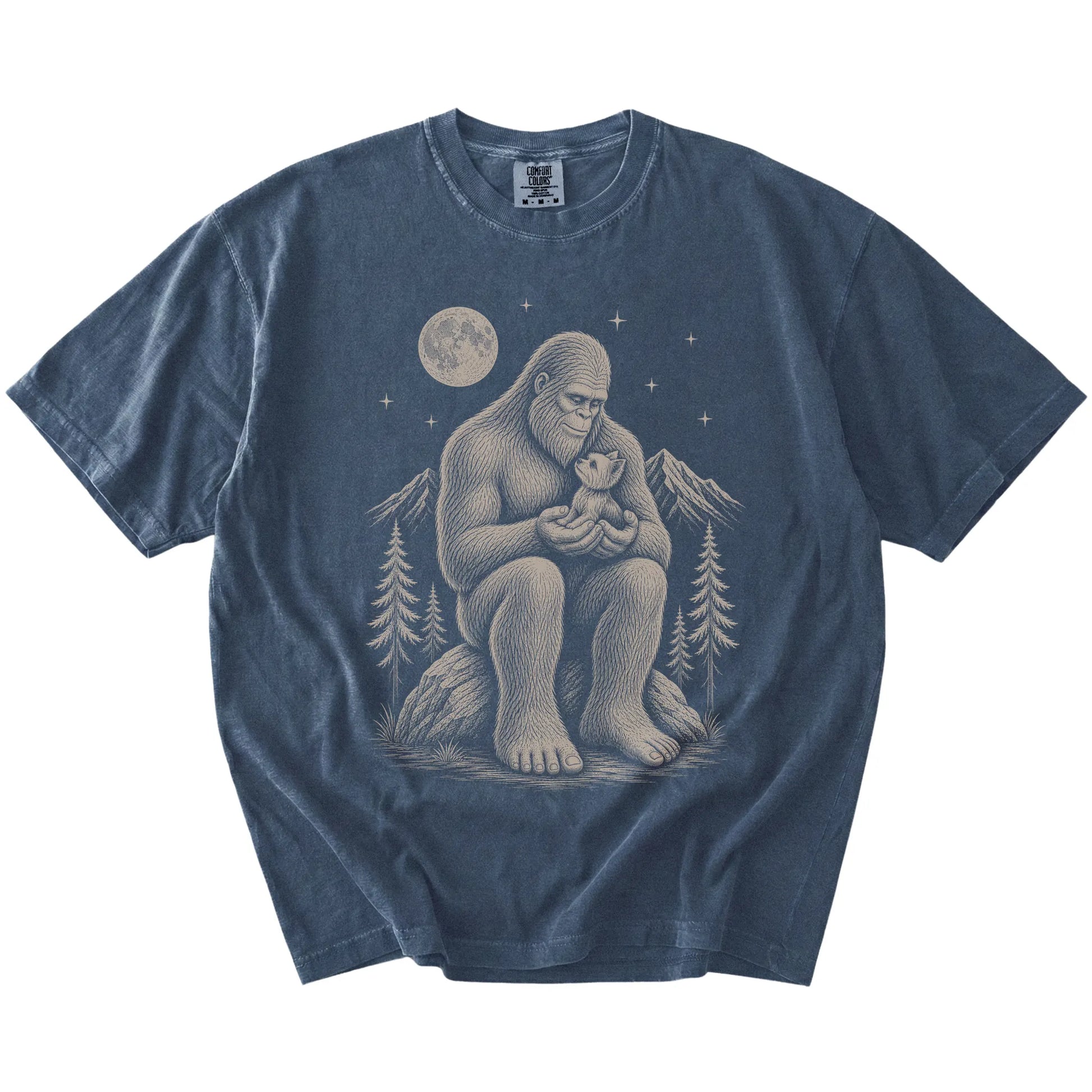 Bigfoot holding a Yorkie on a Denim Comfort Colors® T-shirt