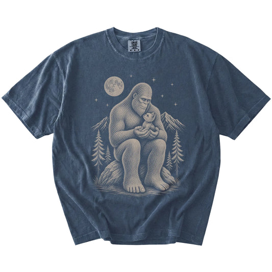 Bigfoot holding a Yorkie on a Denim Comfort Colors® T-shirt