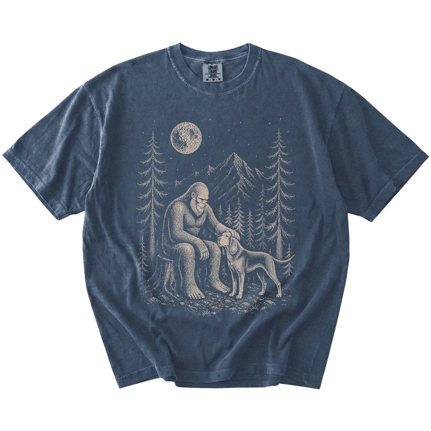 Bigfoot petting a Bloodhound beneath the moon in a pine forest on a Denim Comfort Colors® T-shirt
