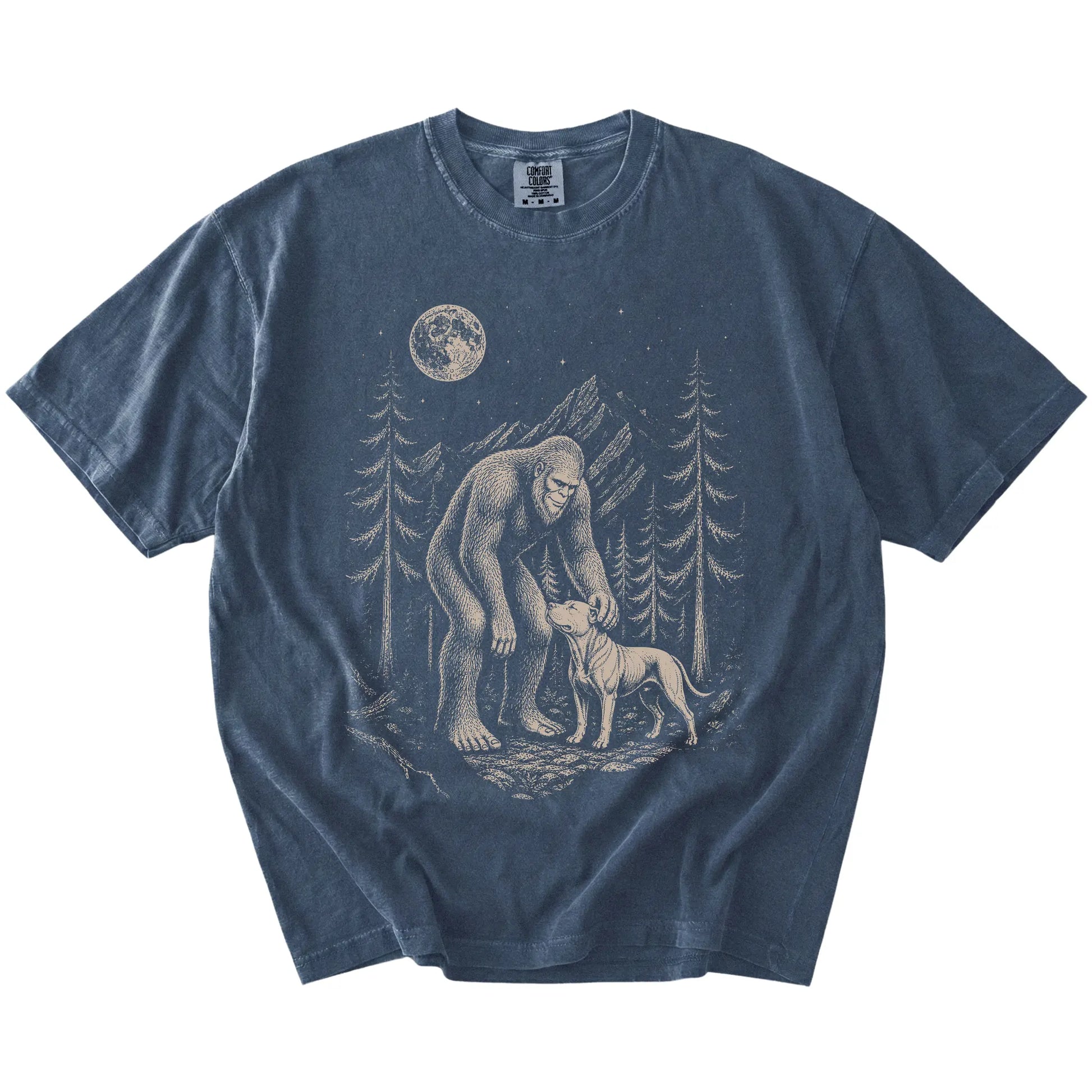 Bigfoot petting a Pitbull beneath the moon in a pine forest on a Denim Comfort Colors® T-shirt