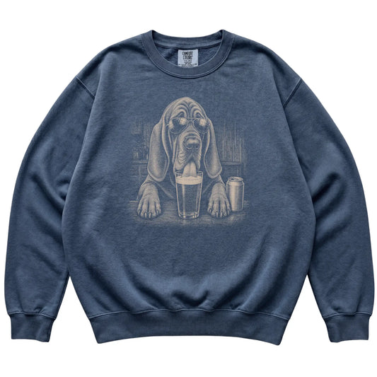 Denim Bloodhound drinking from a pint at a bar, laid flat