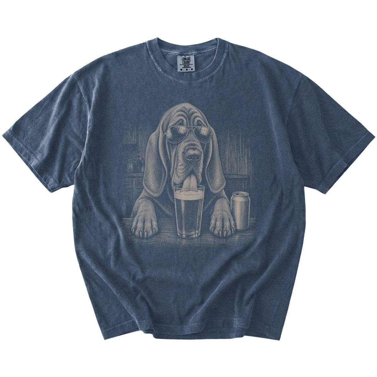 Bloodhound sneaking a drink from a foamy pint at home on a Denim Comfort Colors® t-shirt
