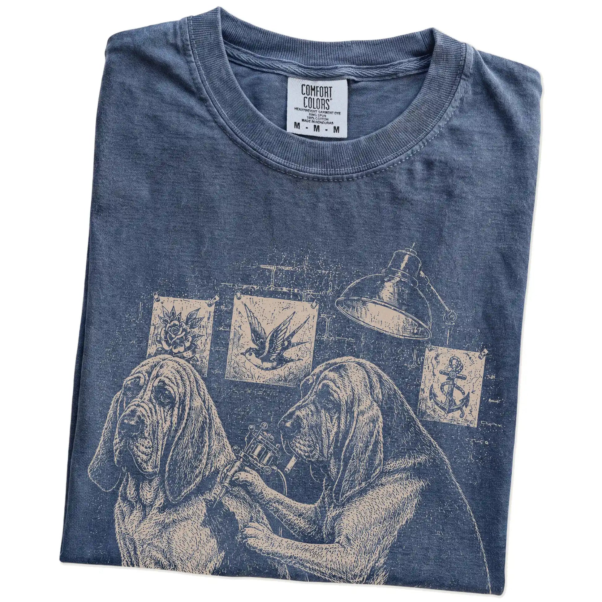 Folded Denim Bloodhound Tattoo t-shirt showing the graphic
