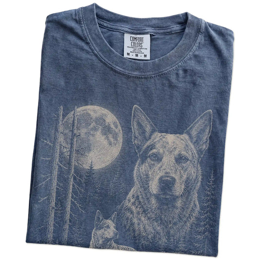 Folded Denim Blue Heeler Moonlit Forest T-Shirt showing the graphic
