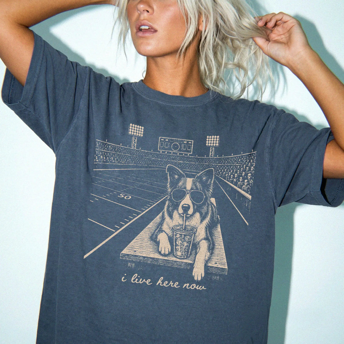 Model wearing a Denim Comfort Colors® T-shirt featuring Border Collie ready for football and tailgate season