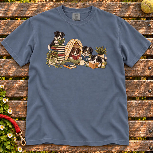 Border Collie puppies reading books in a cozy blanket fort on a Denim T-shirt