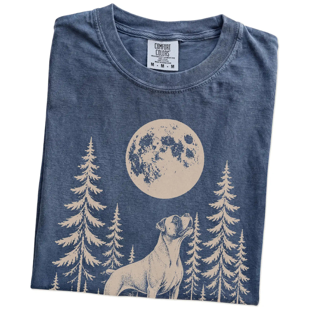 Folded Denim Comfort Colors® T-shirt showing a Boxer howling beneath the moon and pine trees
