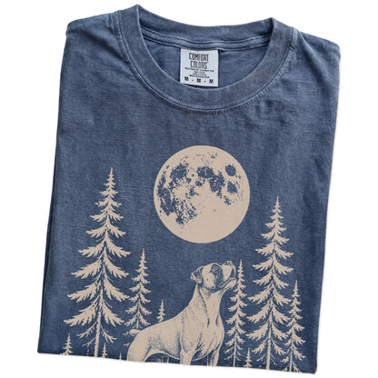 Folded Denim Comfort Colors® T-shirt showing a Boxer howling beneath the moon and pine trees