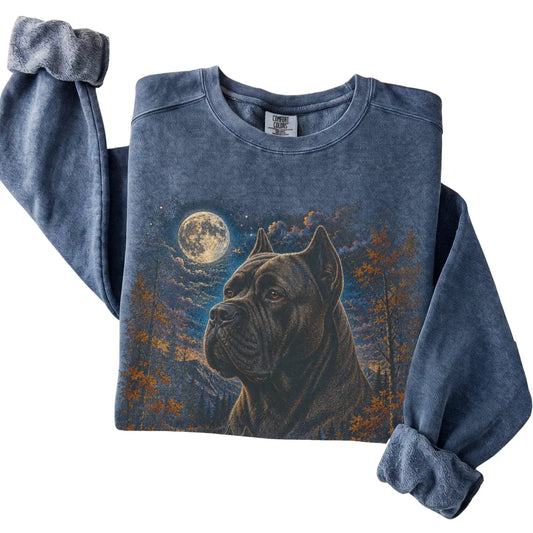 Folded denim sweatshirt with Cane Corso Autumn Moon artwork.
